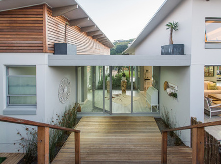 To integrate the property with its natural surrounds, stone cladding and timber decks are used extensively for entertainment areas and walkways 