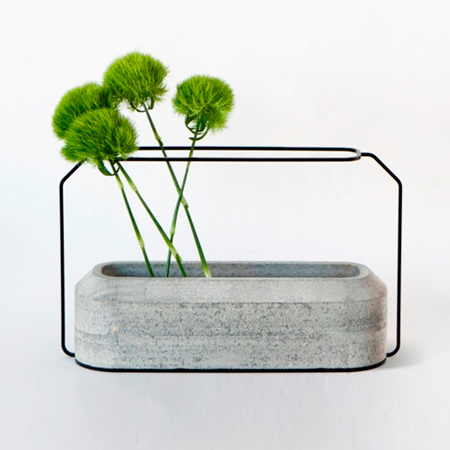 Recognised as an object d'art, the Weight Vase is designed by Decha Archjananun and uses cement as an art form. Concrete vases in 2 parts function together to bring a new perspective on the traditional flower vase. 