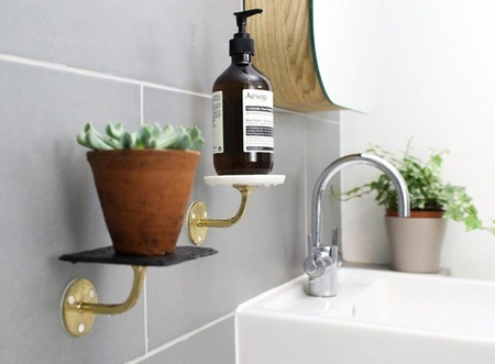 Bathroom fittings usually have 2 parts: the mounting bracket and a nice chrome part. Now you can use Sugru instead of drilling into walls, making this job a whole lot easier. In 24 hours, you'll be ready to use your shelves for setting the mood with candles and plants, or for keeping essential bathroom stuff handy