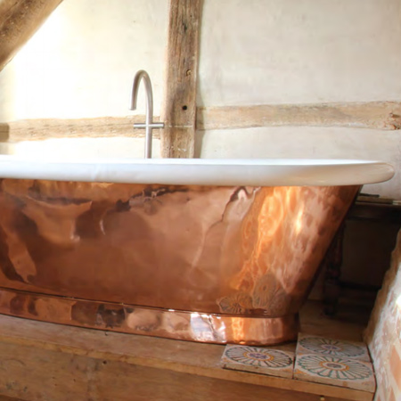 Copper and brass bath tubs retain heat and keep the water temperature warm long after you're wrapped up in a towel. They are beautiful features that are durable and last a lifetime. That's why boutique hotels, luxury developers, and interior designers choose these beautiful pieces.