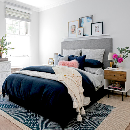 A blah bedroom turns into a grown up sanctuary with navy and gold accents. If your bedroom is in need of a makeover, take inspiration from this project.
