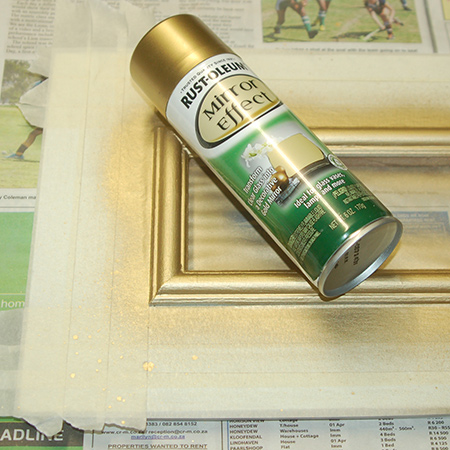 Spray a coat of Rust-Oleum Mirror Effect over the moulding