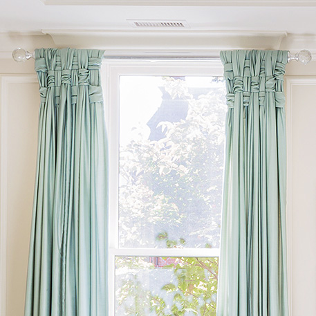 HOME-DZINE | Window Designs - Interior Designer, Leslie Fine, wanted a treatment that would allow the drapes to make a statement in a high-ceilinged room. Rather than just hang plain drapery panels, Leslie and her client came up with a very inspiring way to display curtains. The sheer fabric curtains are woven at the top to frame the window.