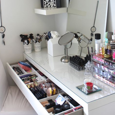 A large pull-out drawer is all that's needed to provide easy access to your makeup collection. Use containers to corral and organise lipstick, eye shadow and nail polish.