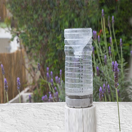 A rain gauge allows you to keep track of summer or winter rainfall, and this simple rain gauge is made by recycling a plastic juice bottle.