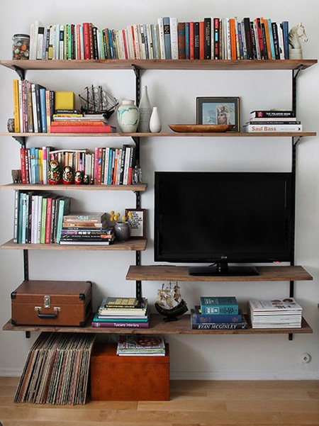Steel shelving is also a great way to display your TV if you don't have room for a TV cabinet or media console. You can disguise electical wires by fastening these to the steel frame so that they aren't messy. 