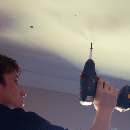 Fix ceiling board to battens