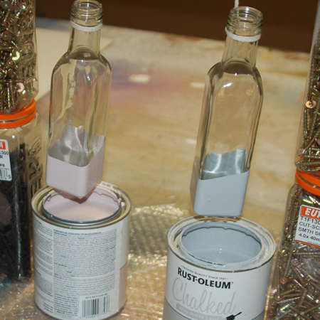 The glass bottles are pretty much like sauce bottles, so you can easily upcycle bottles you have a home. I dipped the bottles in Rust-Oleum Chalked Ultra Matte paint, which gives a luxurious ultra matte chalk paint finish.