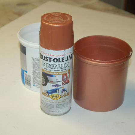 HOME-DZINE | Clean the plastic paint pot and make sure it's dry before spraying on a couple of coats of your choice of Rust-Oleum Metallic spray paint. Apply light, even coats to prevent drips and runs. Rust-Oleum have a range of metallic paints to choose from, and you will find the full range at your nearest Builders Warehouse