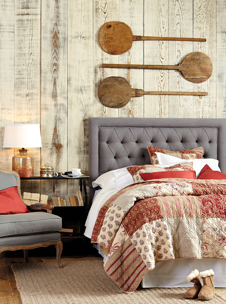 In a bedroom, it's so easy to introduce warm colours with bed linens. Look for bedding sets that incorporate deep, warm reds and pair these with shades of grey to add spice and warmth to the room.