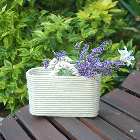 Here's a very simply way to make your own rope baskets. You can find sash cord at your local Builders store.