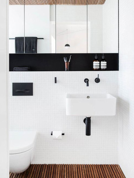 Black is bold, and the perfect touch for a white bathroom that needs a sophisticated edge.