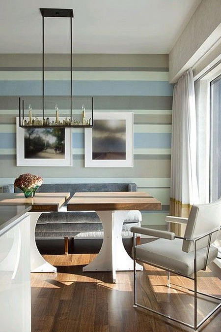 Horizontal stripes on a wall don't have to be in a single colour - tone-on-tone stripes can be used to introduce colour and interest to a plain room. Take colours from the room, tone these down, and paint onto a wall to instantly make a room feel larger.