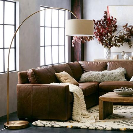 A stunning floor lamp creates a warm ambiance that adds atmosphere to any living room