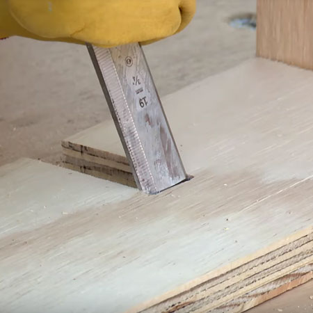 3. Mark the location for cutting out slots to join the shelves together. Cut out with a jigsaw and then clean up the edges with a sharp wood chisel.