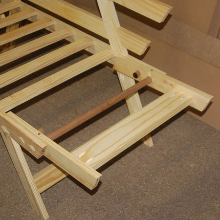 HOME-DZINE | DIY Projects - Futon couch in flat position with dowel inserted to hold level.
