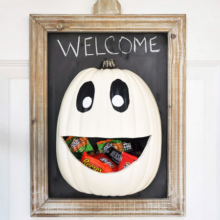 HOME-DZINE | Halloween Crafts - This candy door hanger can be mounted conveniently should the kids come knocking for trick or treat. This project by cherished bliss uses a plastic half-pumpkin, but you can substitute with a real pumpkin cut in half.