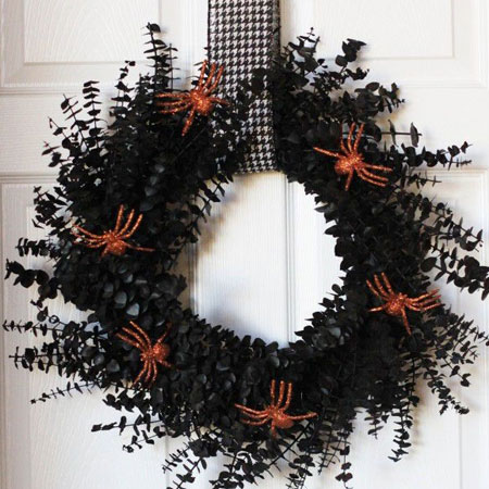 HOME-DZINE | Halloween Crafts - Grab some Rust-Oleum spray paint at your local Builders to make a scary wreath for Halloween. Cut foliage from the garden and spray this with matt black and then glue on spray painted plastic spiders.