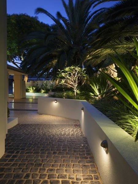 HOME-DZINE - Garden Lighting - Low-level spike lights or wall-mounted buolkheads are excellent for illuminating the edges of pathways or along driveways where the light is usually very low. These lights not only make the areas safe at night, but also add ambience. Another great idea is to run strip lighting under railings or along steps.