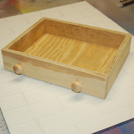 9. Assemble the drawer by gluing the sides, front and back onto the base. 