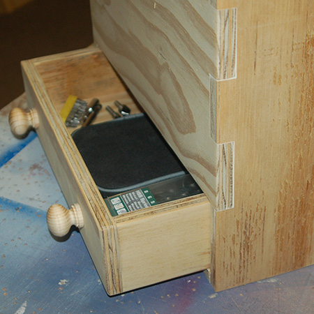 The drawer fits nicely into the back of the tool caddy and is perfect for small accessories. 