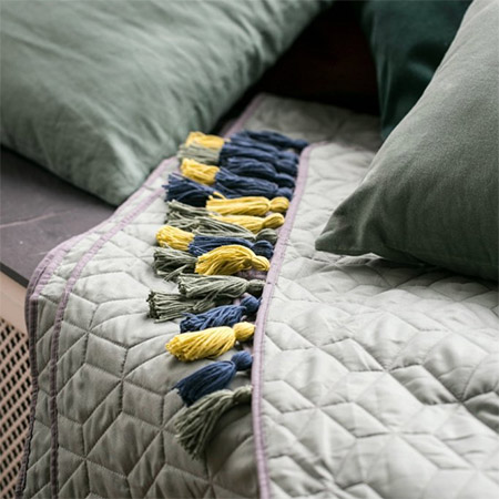 Give last years throws and bedding an instant update with colourful tassels.