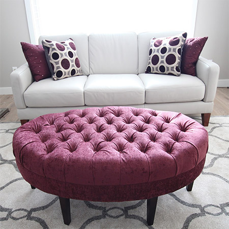 This beautiful tufted ottoman | stool was reupholstered and given a new lease on life