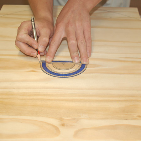 3. Use a protractor to divide the top into 3 sections and draw a line as a guide for attaching the legs.