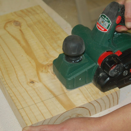 1. To make the curved seat you’re going to use a Planer. Set the cutting depth at 2mm and start 50mm in from the end on one side of the seat – working towards the centre – and then to the other side. 