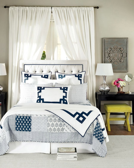 A simple window treatment on a rod is an easy way to frame the bed and make it a stand-out feature in a bedroom. The headboard almost fades into the background while the detailed design draws your attention.
