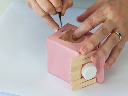 HOME-DZINE | Craft Ideas - Draw an opening at the front and back of the container and cut this out with a craft knife. Also cut small cross shapes just below the openings.
