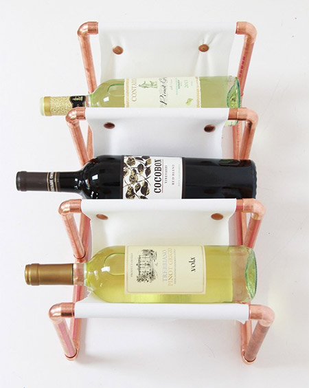 HOME-DZINE | Copper Tube DIY - The copper tube and leather wine rack by Laurel is a great example of how you can use copper tubing to make stunning, practical items for the home. The project is made using lengths of tube, copper Ts and elbows, and cut leather. 