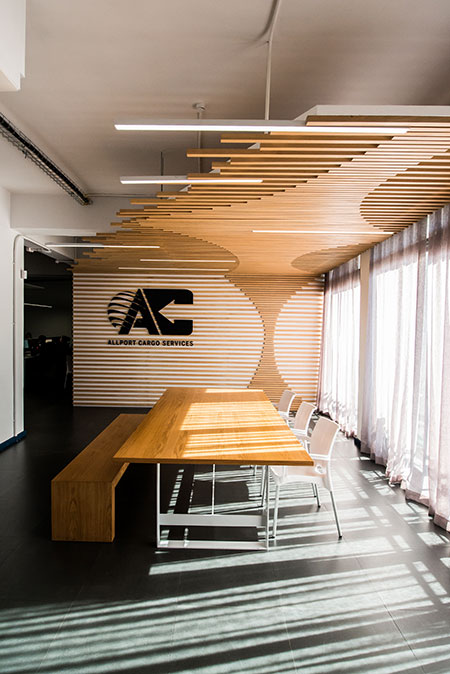 HOME-DZINE | Interior Design - Allport offices - The use of timber is also evident in this room – there are timber chairs and the glass-topped conference table is supported by timber blocks. A photographic mural adds depth to the room. In keeping with the maritime theme, it depicts a seaside vista. 
