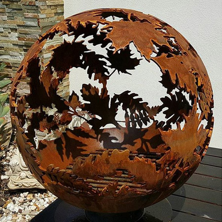 Using a plasma cutter, her designs are transferred directly onto the steel globes