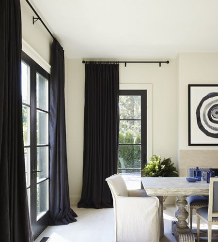 In a room with a low ceiling, add visual height by mounting the curtain track or rail at the top of the wall.