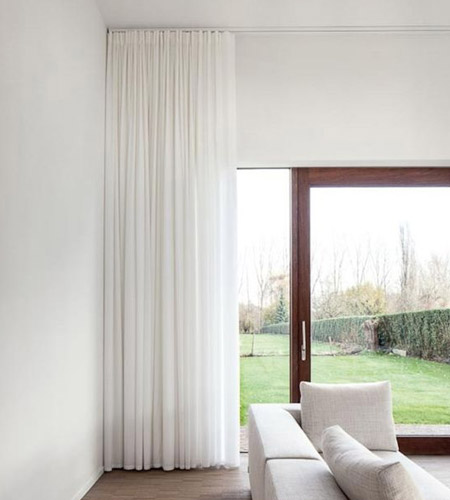 Of course, if you are looking for something a little more sophisticated, you can select a pleated curtain mounted on a slimline track above the door frame. 