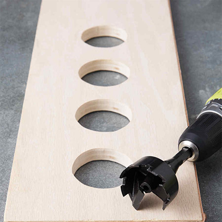 To drill small to medium holes in a shelf you can use either a spade bit, a MAD bit or a Forstner bit 