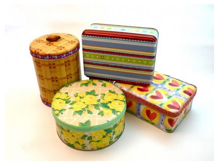There are lots of stores that pack their Christmas goodies into tins, and we show you how to transform these tins with colourful wrapping and scrapbooking paper, to turn them into practical storage containers.