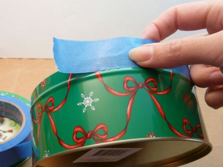 Place masking tape around the top rim of your tins