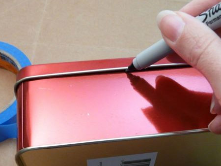 With the lid on, use a permanent marker to draw a line where the lids fits onto the bottom section.