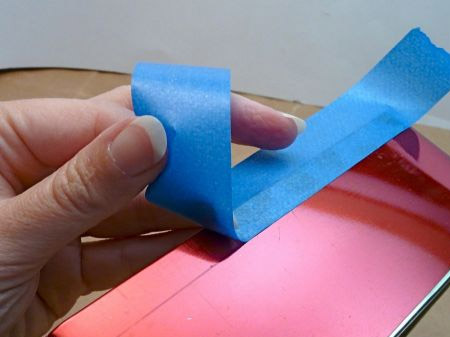Place a strip of masking tape
