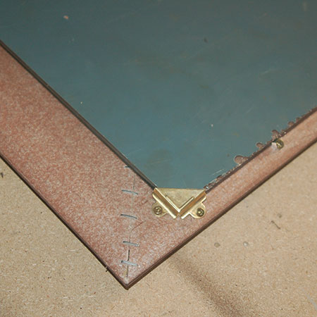 use corner brackets to secure mirror in place