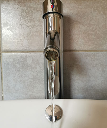 why does water from tap run slow