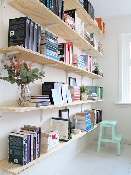 arrange books in piles and stacks