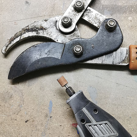 sharpen all your garden tools with dremel multitool and sanding stone