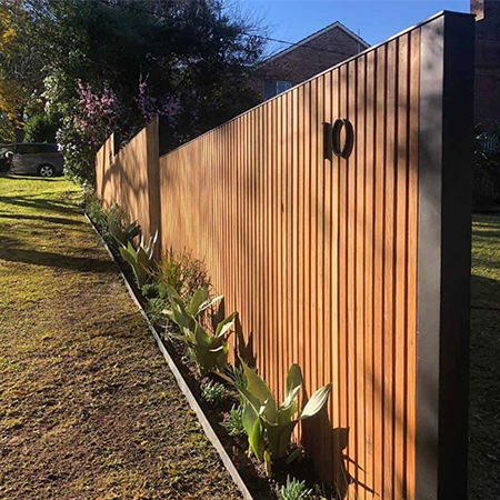 high wooden fence blocks out noise