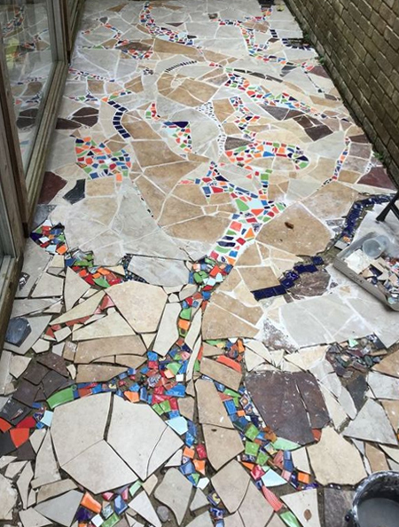 transform an ugly courtyard with broken tiles
