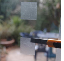Create a sandblasted effect on glass