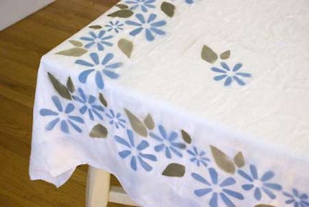 Spray painting a tablecloth